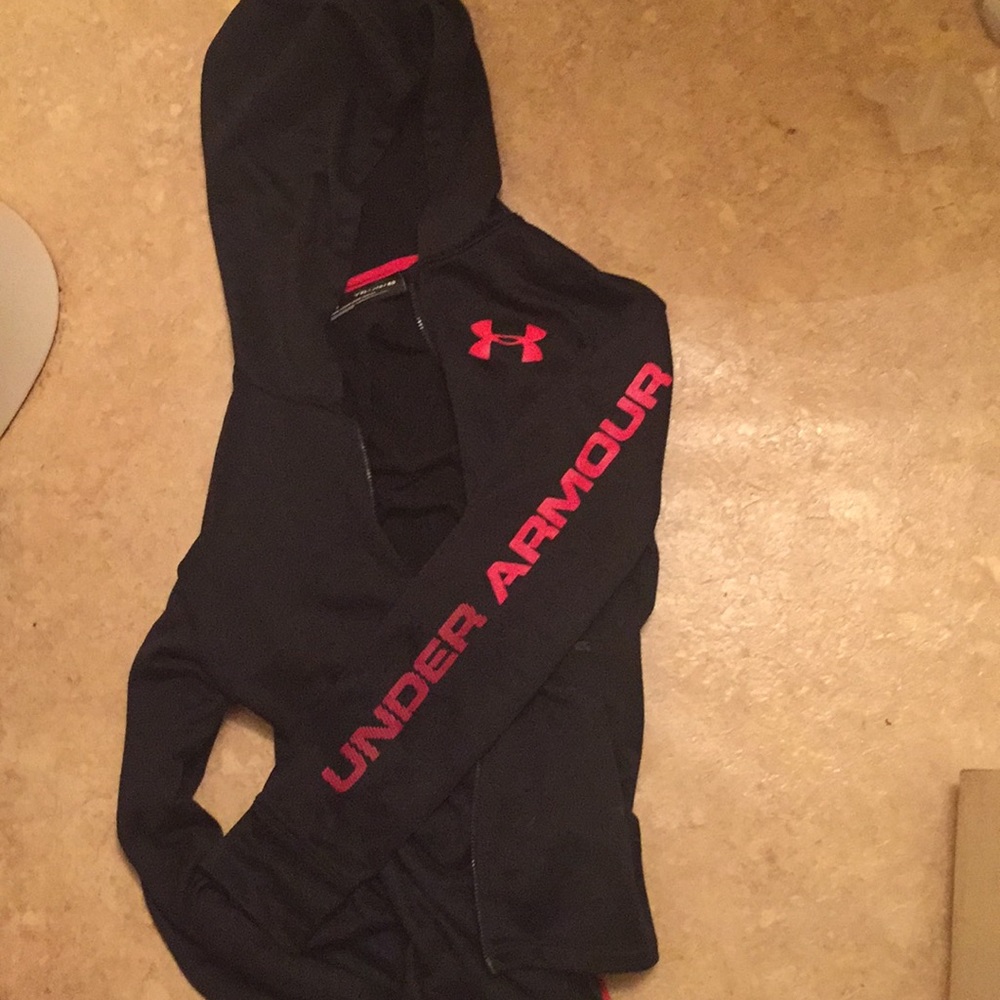 A loose black and red under armour jacket